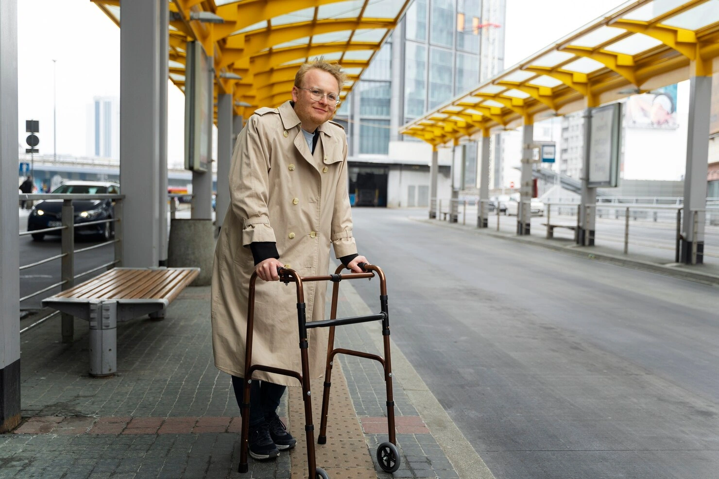 Man with Wheeled Handicap Walker at Urban Transit Station