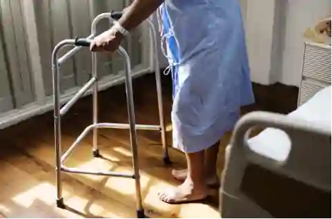 Patient Using Walker in Hospital Room